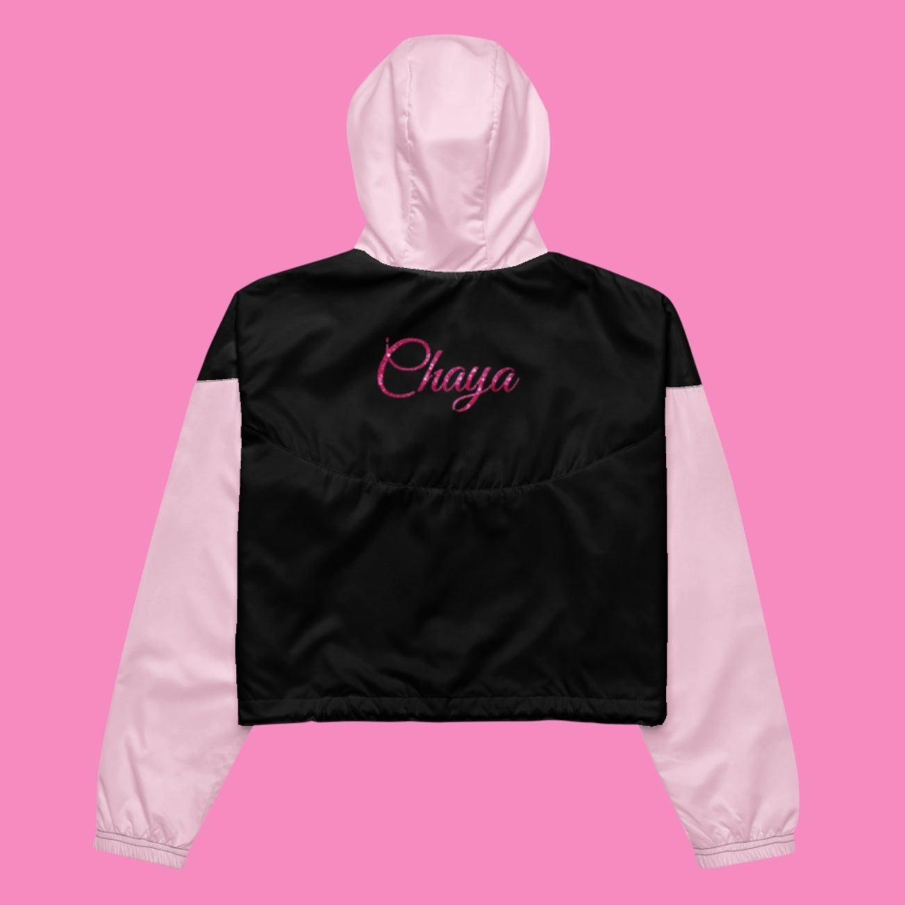 Chaya Windbreaker in Schwarz und Rosa – bauchfreie feministische Regenjacke aus Polyester – Bling Bling Feministas
